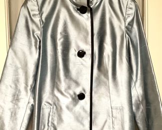 Reversible silver jacket trimmed in black