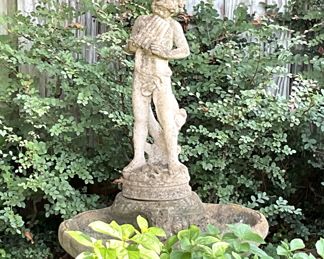 Yard statue with feeder or bird bath space at the base