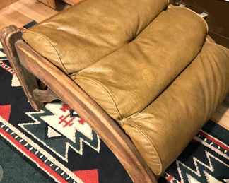 Gold leather upholstered ottoman