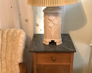 One of two nightstands and lamps