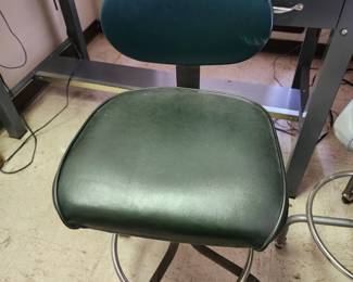 Several adjustable vintage drafting chairs