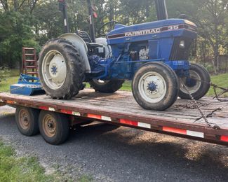 Farmtrac 35 horsepower 3 Cylinder diesel with 5 foot brush hog and a rear scoop   700hrs