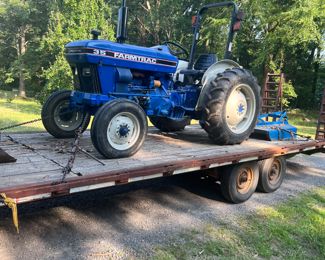 Farmtrac 35 horsepower 3 Cylinder diesel with 5 foot brush hog and a rear scoop   700hrs