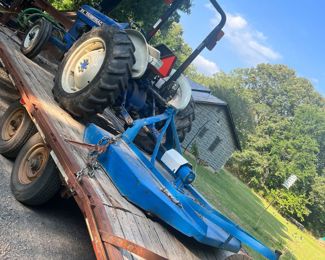 Farmtrac 35 horsepower 3 Cylinder diesel with 5 foot brush hog and a rear scoop   700hrs