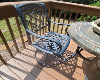 Rocker, swivel cast iron chair with foot stool $40