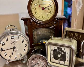 Larger Clock is a Motion Clock w/burning fireplace/electric 