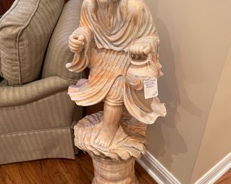 Peach marble statue of oriental god