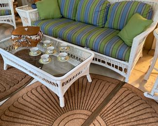 White wicker sofa and coffee table