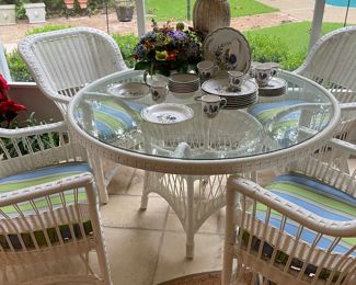 White wicker glass top table and four chairs 