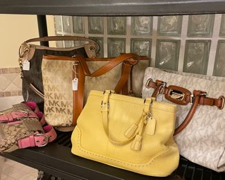 More Michael Kors and Coach handbags