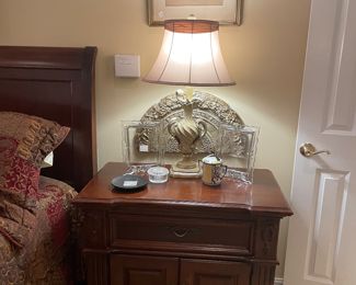 One of a pair of mahogany nightstands 