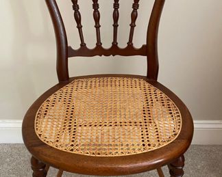Exquisite antique wood and cane chair