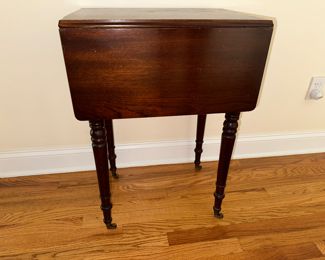 Vintage gateleg side table reveals internal storage