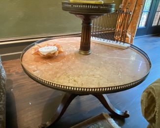 $450.00 Two tier marble-top table 34"h x 30" diameter 