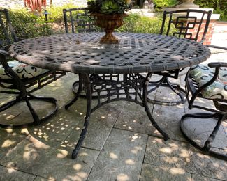 $1500.00 Cast aluminum dining table (with Lazy Susan center) & 6 swivel chairs  table: 27"h x 54" diameter        some flaking in areas
