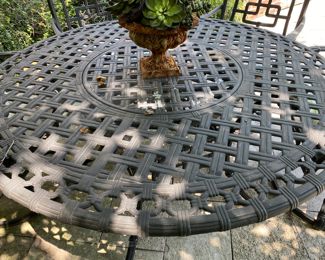 $1500.00 Cast aluminum dining table (with Lazy Susan center) & 6 swivel chairs  table: 27"h x 54" diameter        some flaking in areas