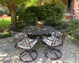 $1500.00 Cast aluminum dining table (with Lazy Susan center) & 6 swivel chairs  table: 27"h x 54" diameter        some flaking in areas
