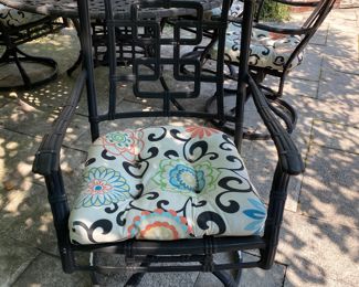 $1500.00 Cast aluminum dining table (with Lazy Susan center) & 6 swivel chairs  table: 27"h x 54" diameter        some flaking in areas