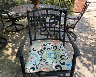 $1500.00 Cast aluminum dining table (with Lazy Susan center) & 6 swivel chairs  table: 27"h x 54" diameter        some flaking in areas