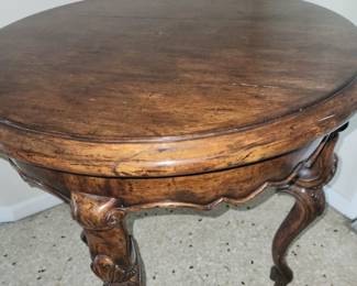 Dark walnut wood grain, surprisingly lightweight 3-legged side table. Round but works great in a corner or any space. $85