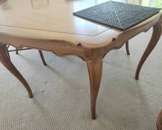 End of the French Provincial Table has two equal positions for the "head-of the table"