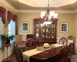 Full hardwood dining set with china cabinet, rug, decor, framed wall art