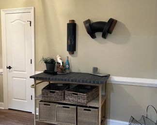 bar cart, gray rattan-style bar cart, wall art, magazine basket, woven storage baskets