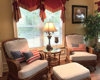 American flag throw pillows, rattan armchairs, beige gray pattern cushions, rattan round side table, silk house plants