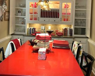 high-gloss red dining table with black chairs,Kate Spade Lenox tableware red, red plates, serving dishes, glassware, table linens
