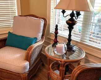 rattan armchair, beige pattern, turquoise throw pillows