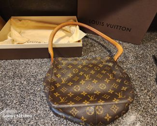 7. LV Handbag in Box with Dust Bag  $450.00