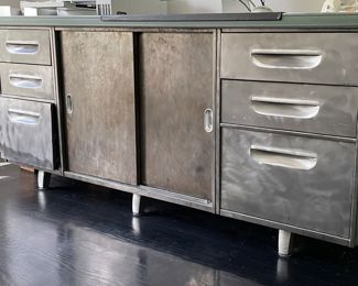 Mid-Century Metal Sliding 2-Door Credenza with 6 Drawers. Measures 70" W x 20" D x 29" H. Photo 2 of 6.