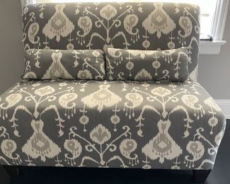 Ikat Upholstered Slipper-Style Love Seat. Measures 54" W x 33" D. Photo 1 of 2.