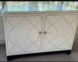 Faux-Leather Two-Door Cabinet with Nailhead Trim & Glass Top.