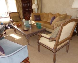 Neutral fabric sofa, coffee table, pairs of chairs (beige chair has a 3rd matching chair)