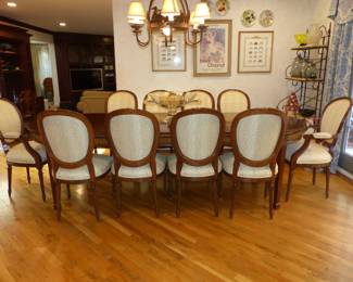 Dining table with 2 leaves, table pads and 10 chairs
