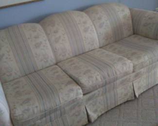 Sofa with matching wingback chair.