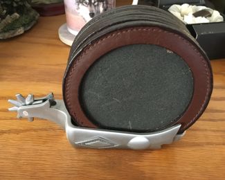 Leather-rimmed coasters in spur holder