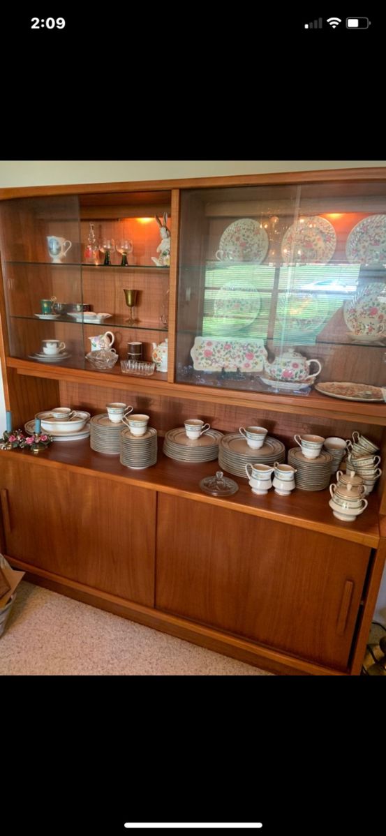 Lighted mid century china cabinet sideboard with sliding glass doors.