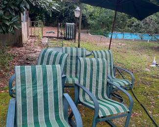 Outdoors table and chairs set with umbrella. 5 chairs, round glass table and umbrella with stand.