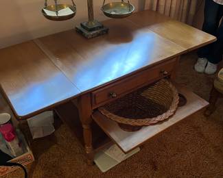 Robert Conant maple drop-leaf table with basket shelf