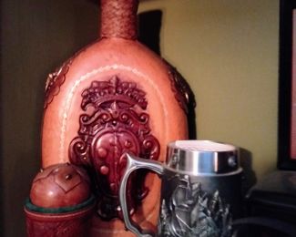 Leather covered bottle and German stein