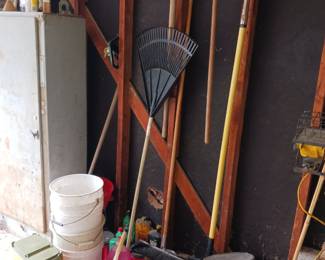 Garden tools rakes and gas cans