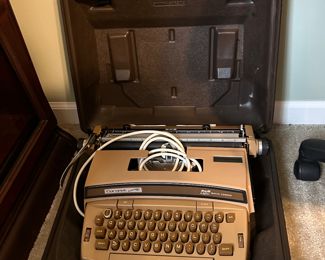 	#23	Vintage Smith Corona electric typewriter with case	 $25.00 				