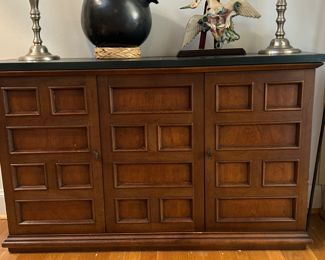 1970's MCM Brutalist credenza with resin synthetic slate top measures  46" across top 28.5" H and 12" D has a single shelf across its interior length shown with mounters Chinese Roof tile and and 21" pewter candlesticks