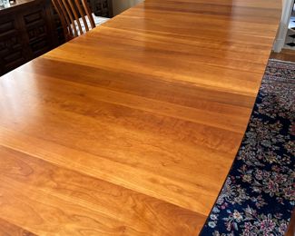 Solid cherry Harden dining room table with two leaves and 8 matching chairs (2 arm, 6 side) Total length with 2 16"  leaves is 98" Harden dining room table shown fully open with 2 leaves