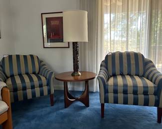 A pair of Brandywine Design Calico Corners striped upholstery armchairs , vintage wallpaper cylinder roll lamp atop a MCM side table in the style of Broyhill Brasilia.
