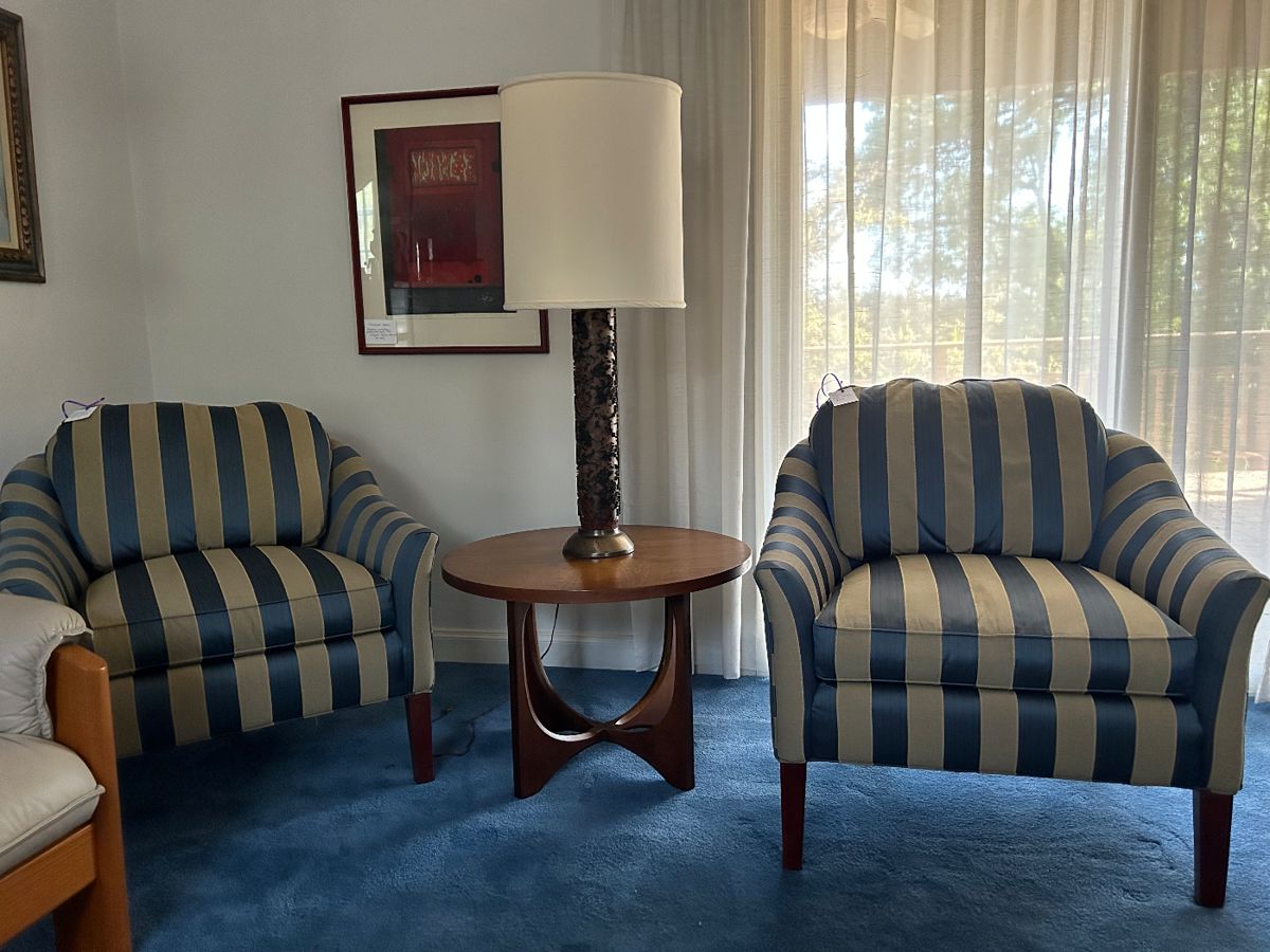 A pair of Brandywine Design Calico Corners striped upholstery armchairs , vintage wallpaper cylinder roll lamp atop a MCM side table in the style of Broyhill Brasilia.