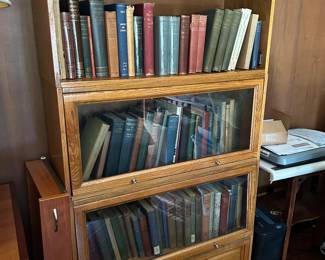 Modern lawyer's bookcase with collectible books