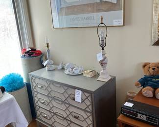 Same Geometric 3 drawer dresser,  different day under a framed James Harrill Museums Editions Ltd. poster. Vintage lamps, wetc.